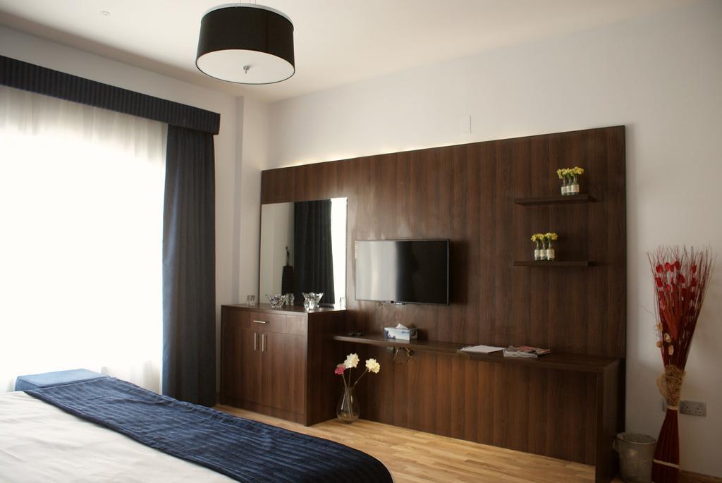 Weekend Hotel & Apartments Mascate Quarto foto