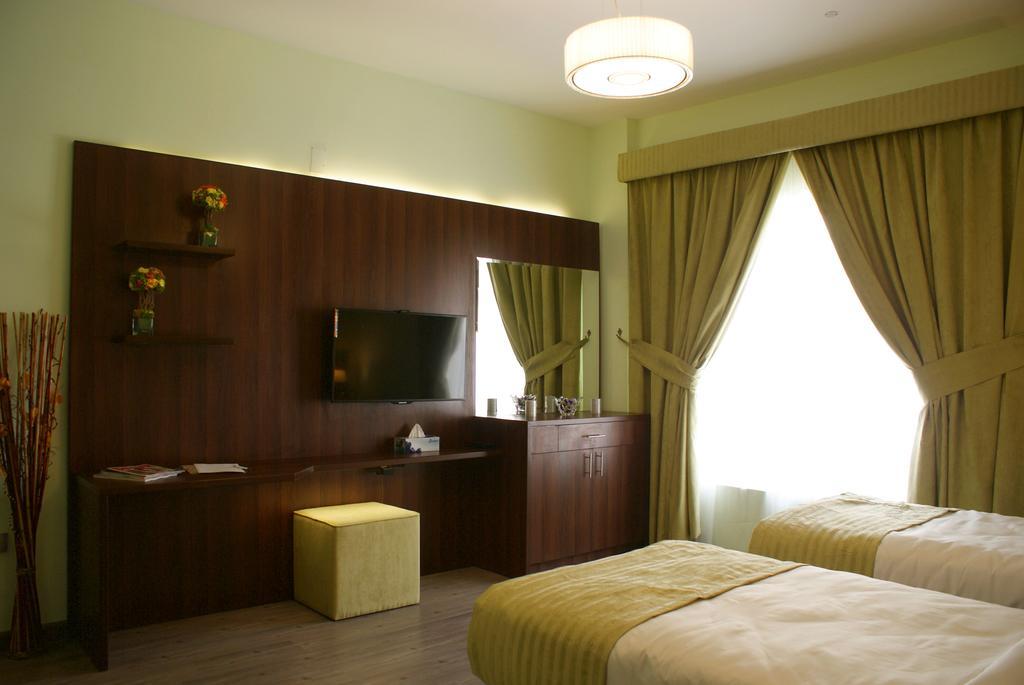 Weekend Hotel & Apartments Mascate Quarto foto